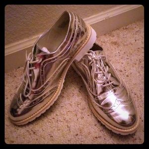 Silver laced up flats